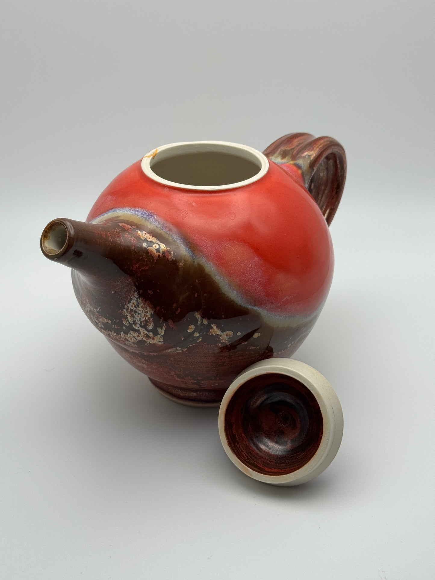 Round red teapot