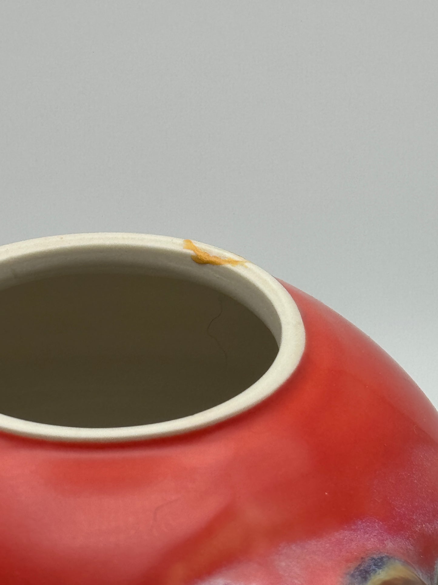 Round red teapot