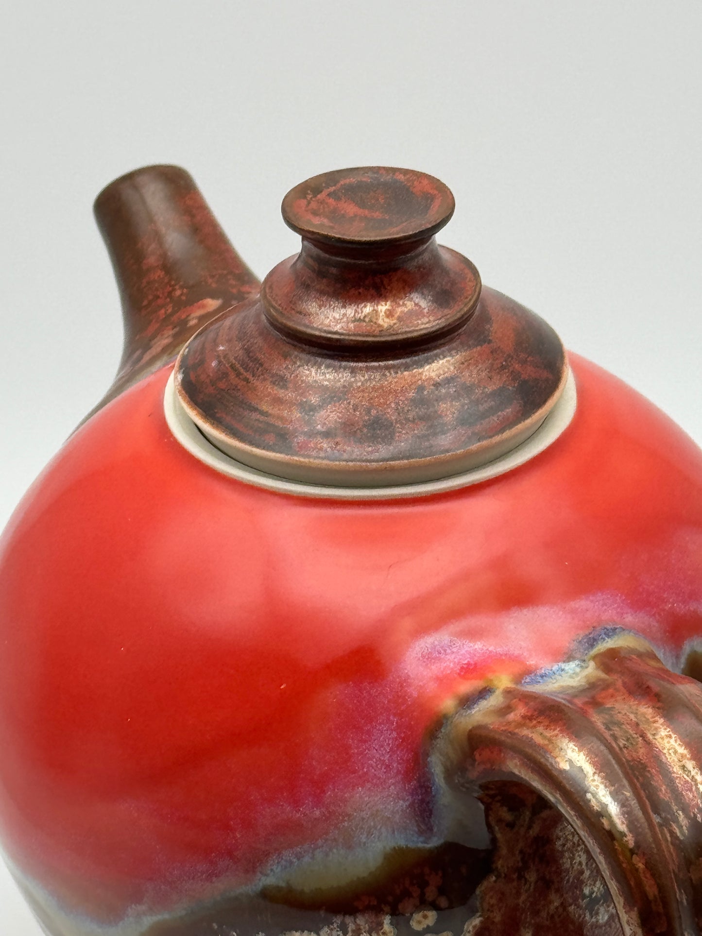 Round red teapot