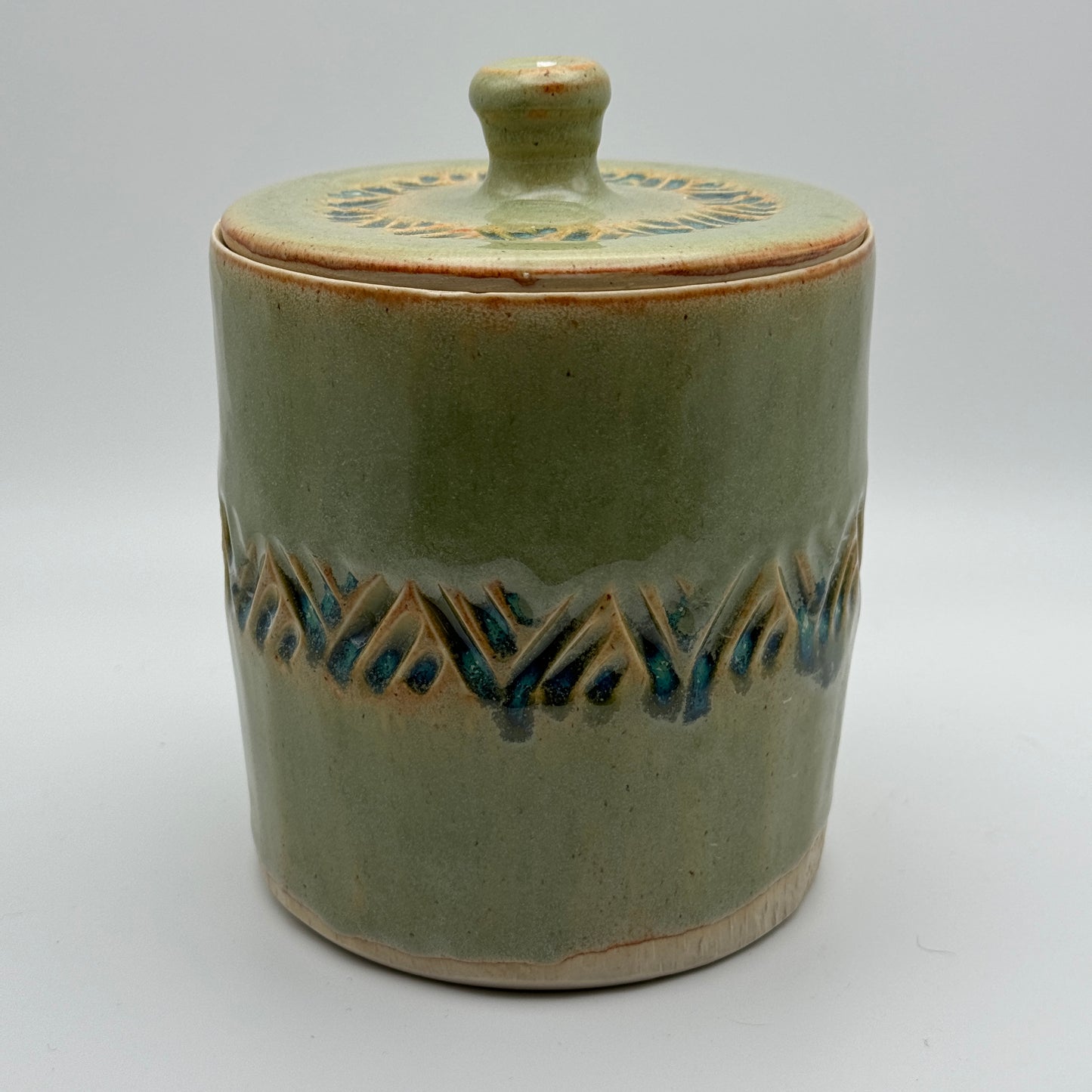 Green carved lidded jar