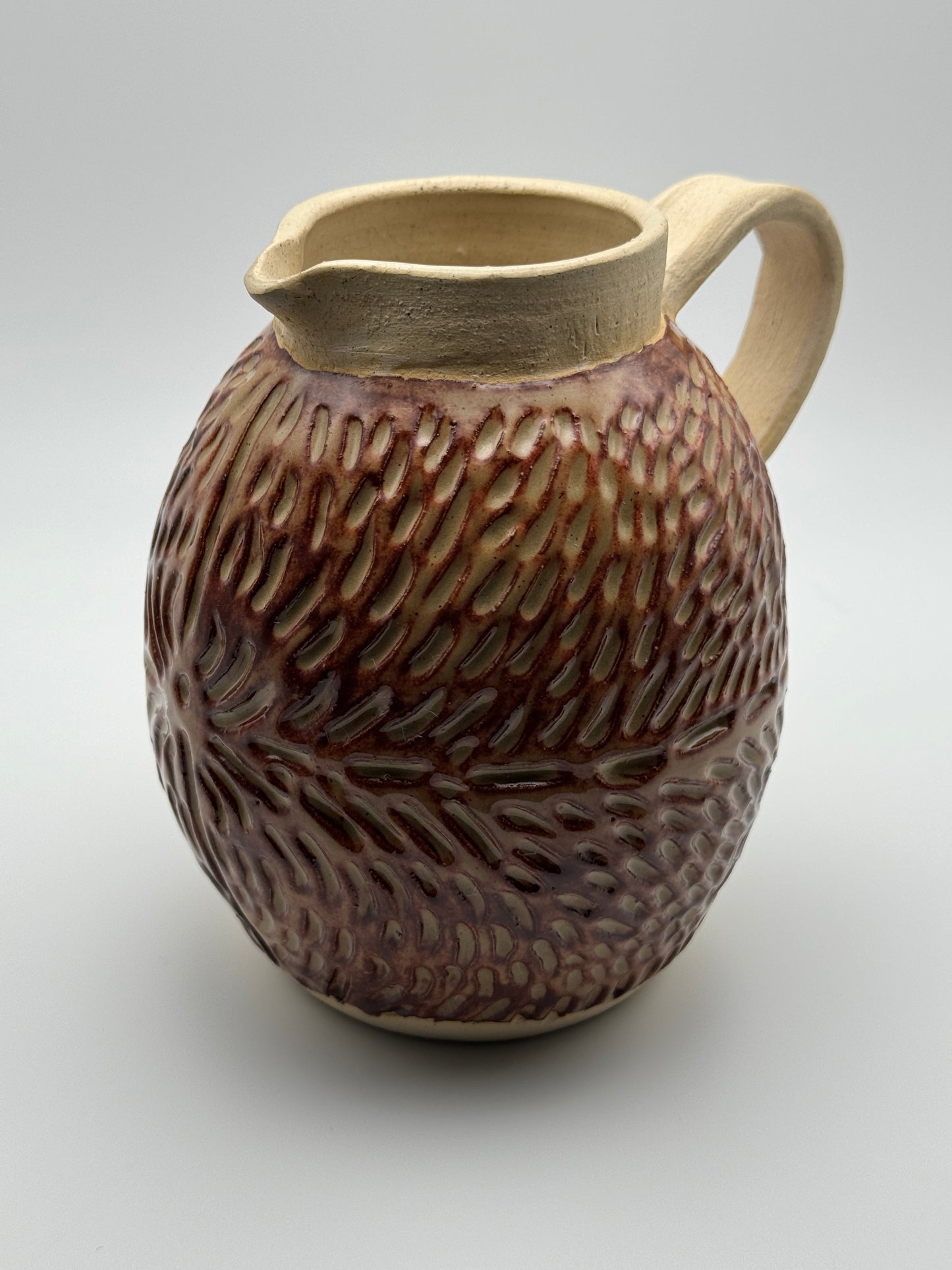 Carved pitcher