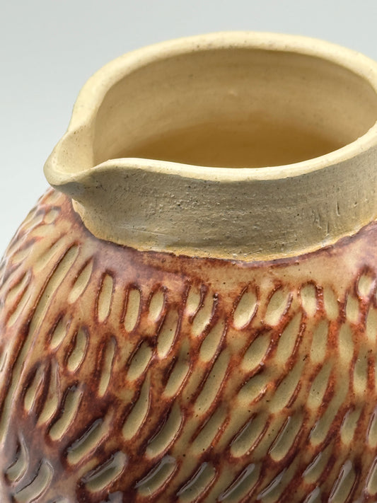 Carved pitcher