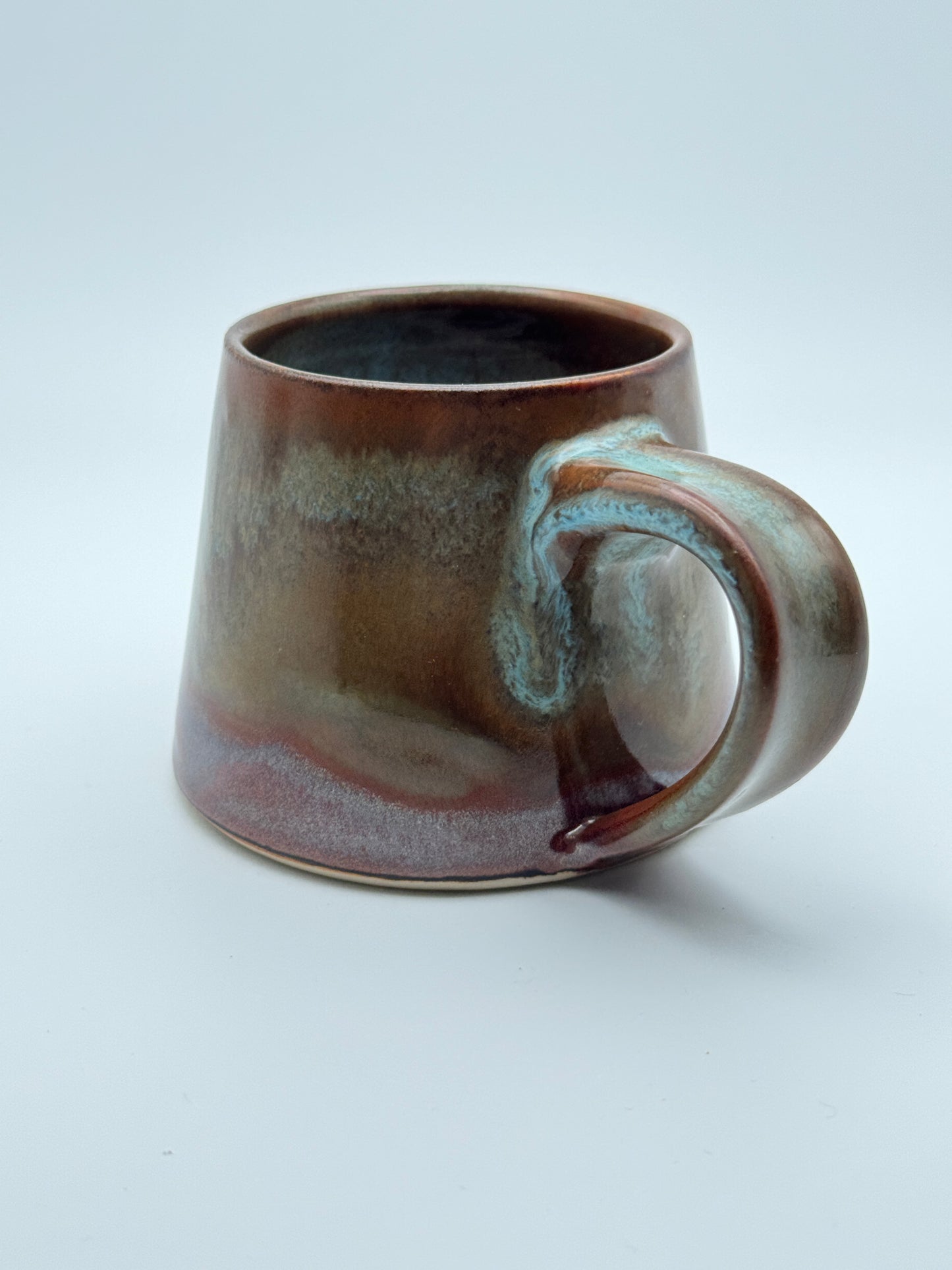 Carved antique copper and blue mug