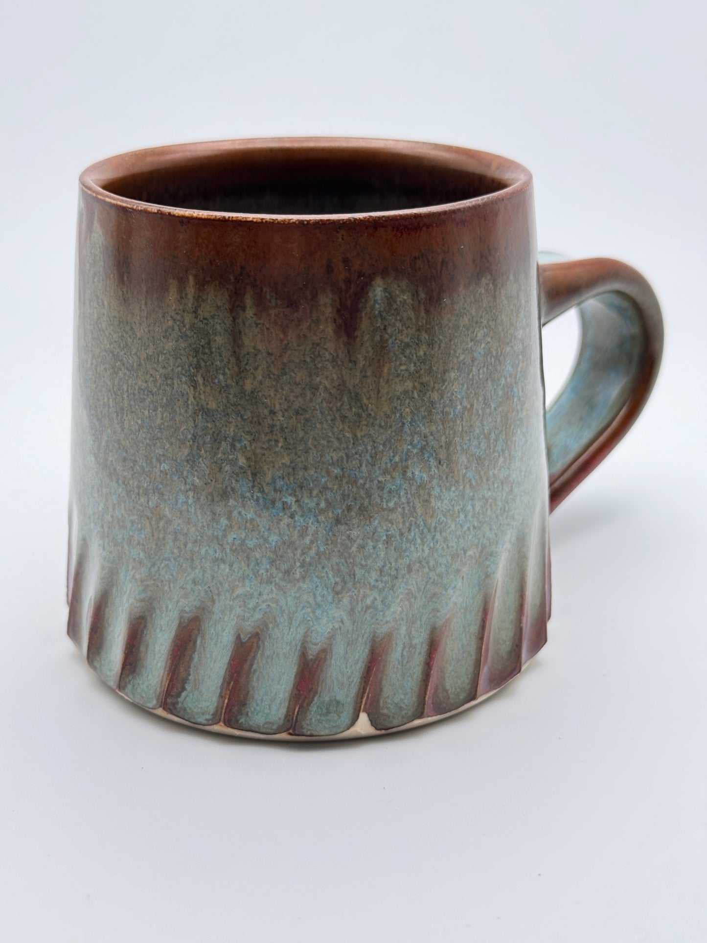 Carved antique copper and blue mug