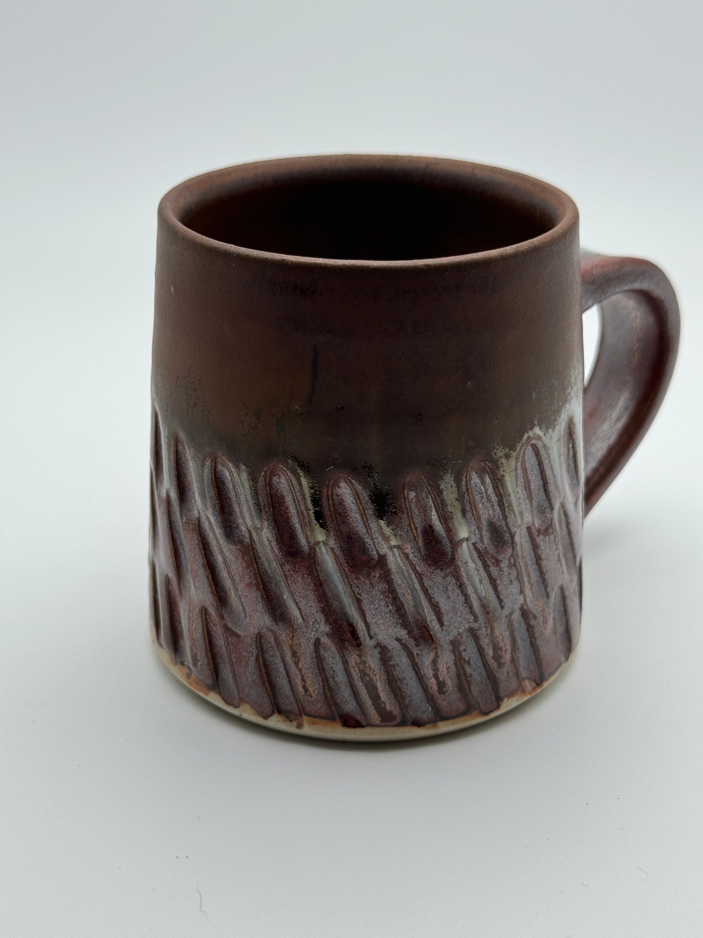 carved matte and glossy copper mug