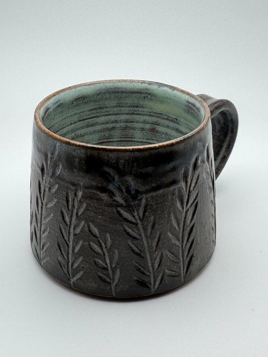 Carved açai mug with botanical motifs